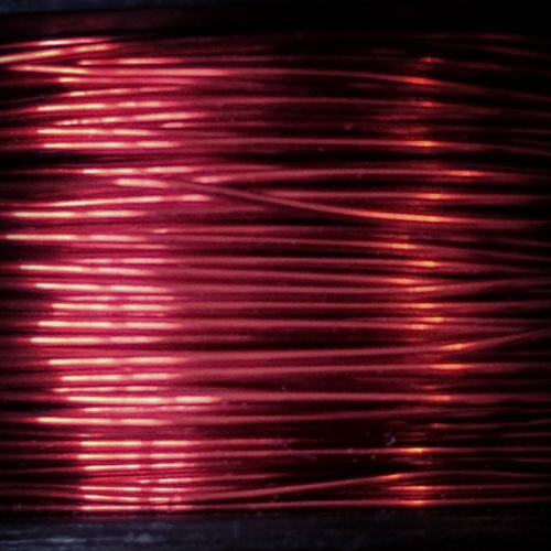 red wire wrapped tightly around a spool
