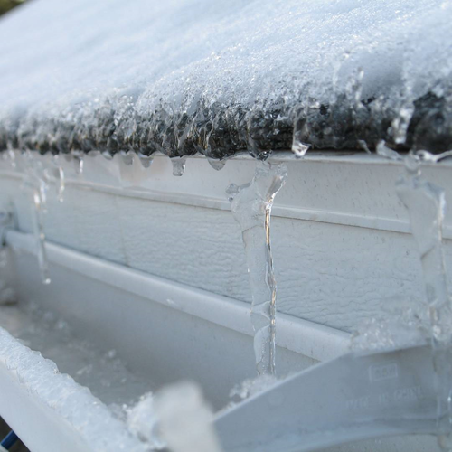 Icicles and snow in a rain gutter